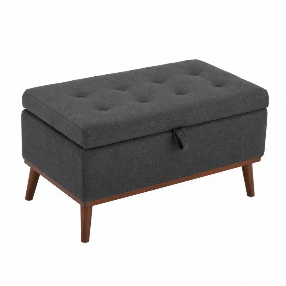 Banco de almacenamiento tapizado en tejido de poliéster gris capitoné con tapa abatible y patas de madera 100 x 40 x 45 cm